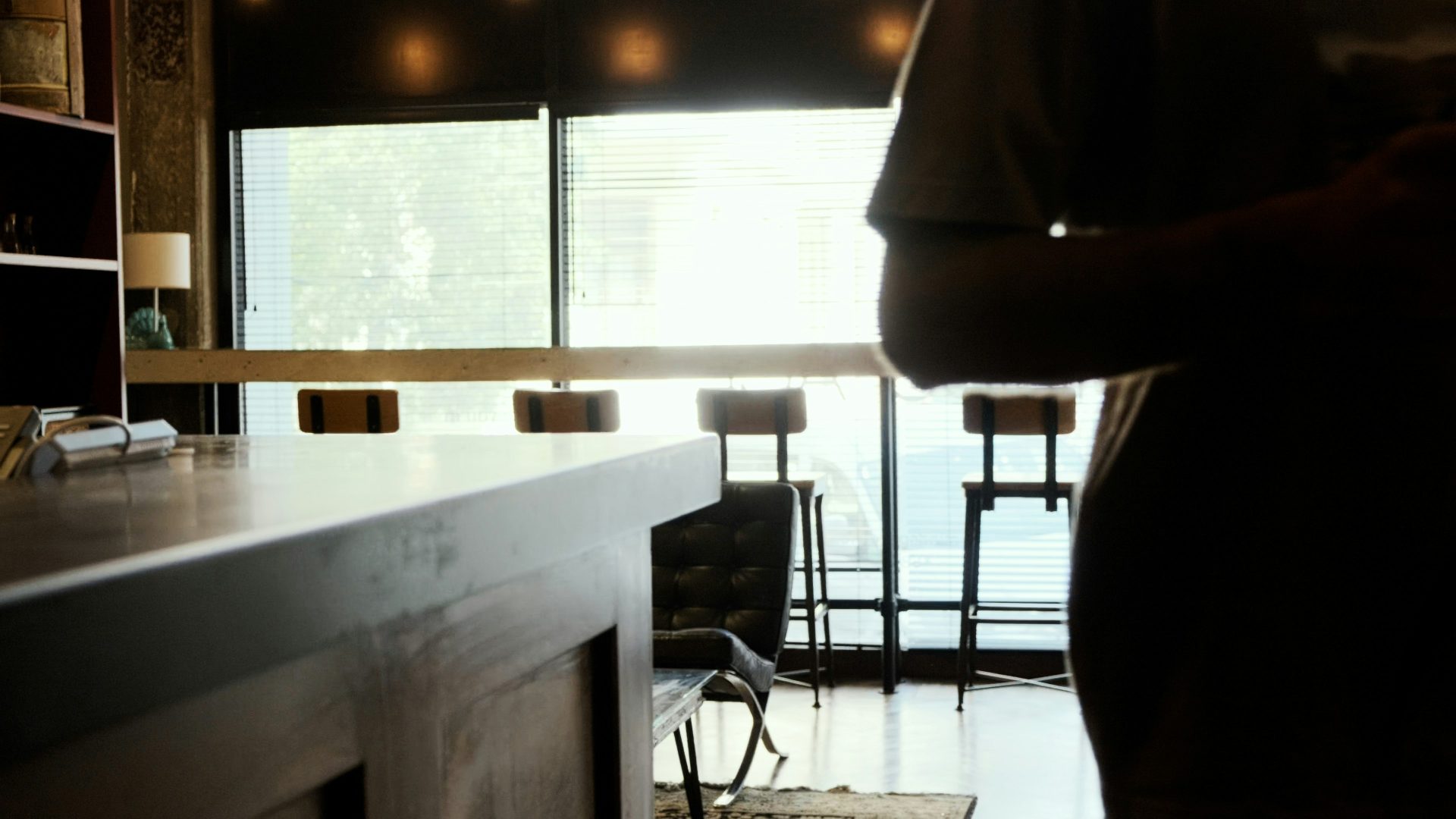 a man standing in a kitchen next to a counter